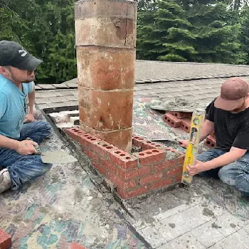 Finished brick chimney repair providing durable weather protection in Tacoma, WA.